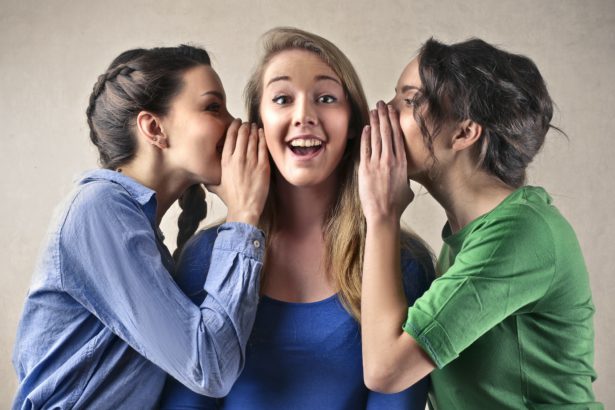 Girls telling secrets