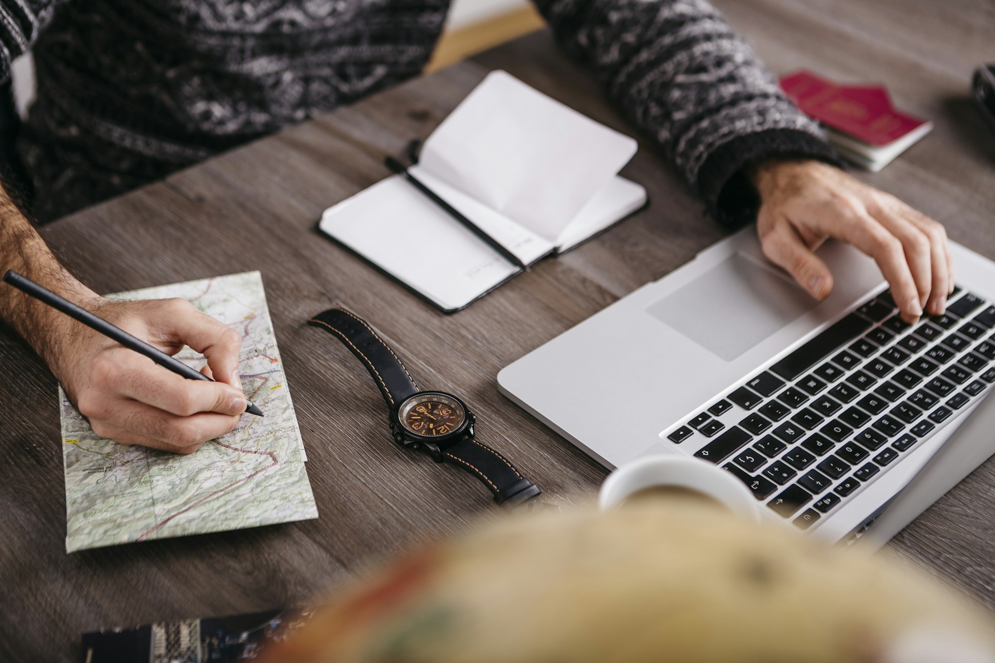 Man using laptop planning a trip