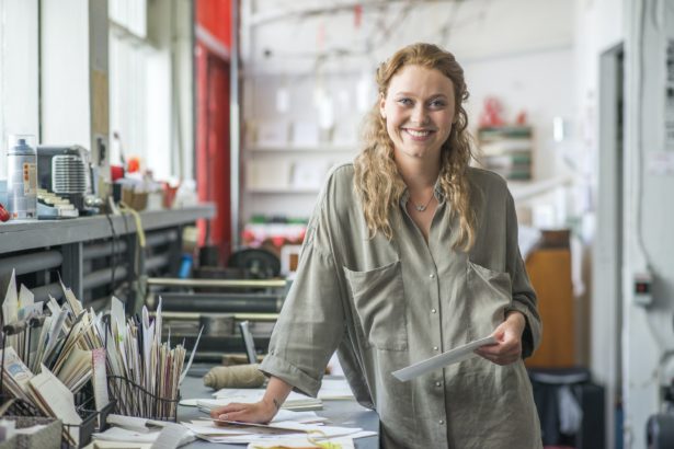 Portrait of female print designer in workshop